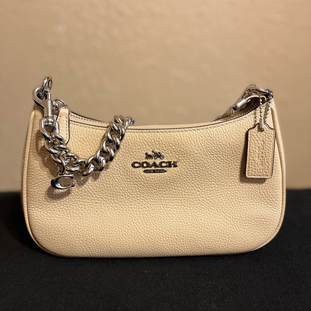 Cream colored coach bag